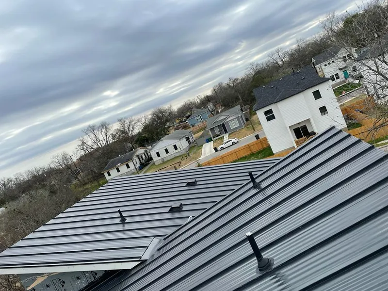 Standing seam metal roof panels with vents for Skylight Repair in Austin